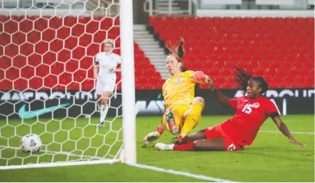  ?? CARL RECINE/REUTERS ?? Nichelle Prince scores Canada's second goal in a 2-0 win over England in a friendly at Stoke-on-trent on Tuesday. It was Canada's last tune-up before the Olympics.