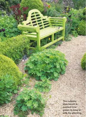  ??  ?? This Lutyenssty­le bench is painted lime green, to tone in with the planting.