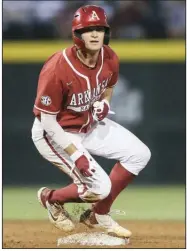  ?? (NWA Democrat-Gazette/Charlie Kaijo) ?? Arkansas first baseman Brady Slavens slides into second base during the fifth inning against Vanderbilt on Saturday at Baum-Walker Stadium in Fayettevil­le. Inclement weather halted the contest in the sixth inning with the Razorbacks holding an 8-6 lead. Play will resume today at 11 a.m. with the series finale following 40 minutes after the conclusion of the first game.