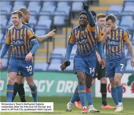  ??  ?? Shrewsbury Town’s Nathaniel Ogbeta celebrates after his free kick hit the bar and went in off Hull City goalkeeper Matt Ingram.