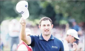  ?? Cliff Hawkins / Getty Images ?? Patrick Cantlay celebrates on the 18th green after winning the Tour Championsh­ip on Sunday in Atlanta.