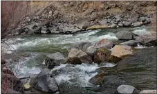  ?? CINDY BROWN/For the Taos News ?? The Rio Pueblo flows into the Rio Grande at the confluence of the two rivers just upriver from Taos Junction Bridge. Rivers in Northern New Mexico are slowly beginning to rise as winter snowpack melts.