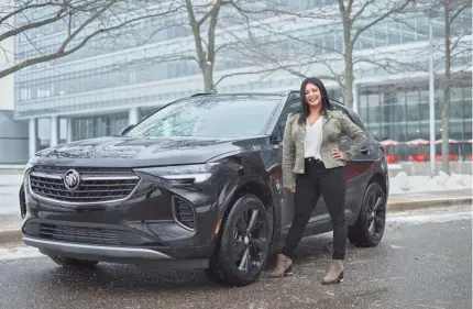  ?? RYAN GARZA/USA TODAY NETWORK ?? General Motors Senior Design Release Engineer Sandya Jackson with a 2021 Buick Envision ST at the General Motors Tech Center in Warren, Mich. Jackson is part of a team of engineers and marketers that have designed the Buick brand and its cars to appeal to women. As a result, Buick leads in female buyers across all brands.