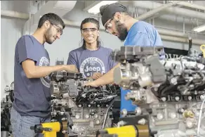  ?? CENTENNIAL COLLEGE ?? Mechanics students work on an engine at the Ashtonbee Campus of Centennial College in Scarboroug­h, Ontario.