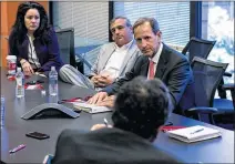  ?? WILLIAM THWEATT / STAFF ?? GeorgiA Power CEO PAul Bowers (top right), meeting with JournAlCon­stitution reporters, sAid PlAnt Vogtle’s delAys And cost overruns Are not the result of mistAkes by the utility.