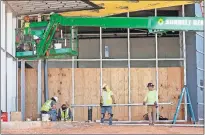  ??  ?? Constructi­on workers don't expect to be delayed by weather anymore at the new Oklahoma Contempora­ry Arts Center at NW 11 and Broadway. [NATE BILLINGS/ THE OKLAHOMAN]