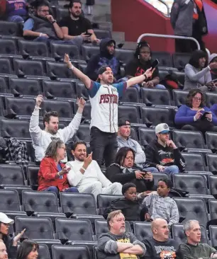  ?? JUNFU HAN/DETROIT FREE PRESS ?? Pistons fans react to a play against the Grizzlies during the second half of the Pistons' 116-102 loss on Dec. 6, 2023, at Little Caesars Arena.