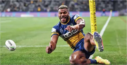  ?? Photo: NRL.com ?? Parramatta Eels winger Maika Sivo slides over to score the first of his four tries against Cowboys at the Bankwest Stadium, Sydney, Australia on July 3, 2020.