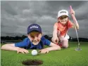  ??  ?? Charlie Smyth (10) and Erin Smyth (8) launch the Irish Kids Golf Tour at Slieve Russell Golf Club