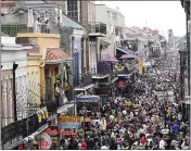  ??  ?? Bourbon Street was a sea of humanity on Mardi Gras on Feb. 25, but the coronaviru­s scare has halted the party.