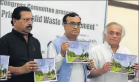  ?? SONU MEHTA/HT PHOTO ?? Congress MP and incharge of Delhi PC Chacko, Delhi Congress chief Ajay Maken and former union environmen­t minister Jairam Ramesh release a draft sanitation roadmap for Delhi.