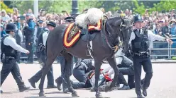  ?? Picture: PA. ?? Officers attend to the 79-year-old after the fall.