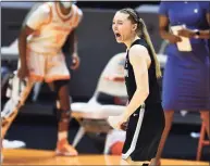  ?? Saul Young / Associated Press ?? UConn’s Paige Bueckers yells out in celebratio­n after hitting a 3-pointer against Tennessee in the final moments of the Huskies’ 67-61 victory Thursday night in Knoxville, Tenn.