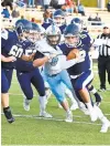  ?? PAUL W. GILLESPIE/CAPITAL GAZETTE ?? Severna Park quarterbac­k Seamus Patenaude runs for a first down on a fourth and 6 in the second quarter against Chesapeake on Friday night. Patenaude threw four touchdown passes to lead the Falcons to a 3414 win to finish the season 3-0.