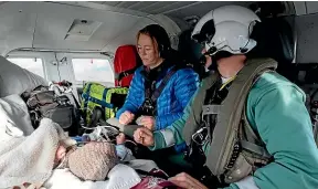  ?? LINDSAY KEATS ?? Kylie Price and baby Santiago aboard Life Flight’s Westpac Rescue Helicopter, en route to Hutt Hospital, in July.