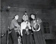  ??  ?? Roy Cuff, center, on the Grand Ole Opry, ca. 1940. Courtesy Grand Ole Opry Archives.