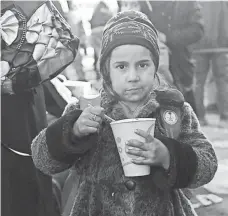  ?? BARAA AL-HALABI, AFP/GETTY IMAGES ?? Syrian girl after being evacuated to west of Aleppo on Dec. 20. More than 34,000 people were rescued from Aleppo.