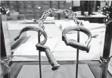  ?? CHIP SOMODEVILL­A, GETTY IMAGES ?? Slave shackles at the Smithsonia­n’s National Museum of African American History and Culture.