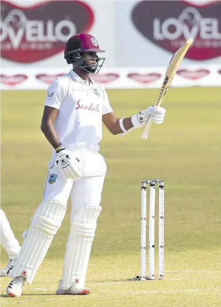  ?? (Photo: AFP) ?? West Indies Captain Kraigg Brathwaite celebrates after scoring a half-century during the third day of the first cricket Test match against Bangladesh at Zahur Ahmed Chowdhury Stadium in Chittagong, Bangladesh on Friday.