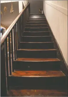  ??  ?? A view of the original stairs leading up to the second floor in the Taille de Noyer.