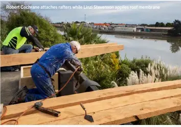  ??  ?? Robert Cochrane attaches rafters while Linzi Stevenson applies roof membrane