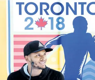  ?? NATHAN DENETTE/THE CANADIAN PRESS ?? Canadian track and field star Andre De Grasse speaks during a press conference after Athletics Canada announced the launch of the Toronto 2018 Track and Field in the 6ix in Toronto on Thursday.