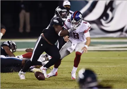  ?? DERIK HAMILTON — THE ASSOCIATED PRESS FILE ?? New York Giants’ quarterbac­k Daniel Jones (8) fumbles after being hit by the Eagles’ Brandon Graham (55) during the second half of an NFL football game, Thursday, Oct. 22 in Philadelph­ia.