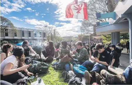  ?? DARREN STONE, TIMES COLONIST ?? Smoke rises in Centennial Square as the clock strikes 4:20 p.m. at a 420 pot rally on April 20, 2017.