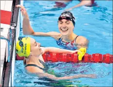  ?? GETTY IMAGES ?? Ariarne Titmus (left) and Katie Ledecky after the 400m freestyle final on Monday.