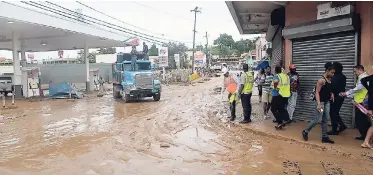  ?? FILE ?? Business places in downtown Montego Bay were covered in mud after the heavy rains there last November.