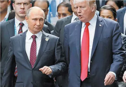  ?? ATTA KANARE/AFP ?? El republican­o con su par del Kremlin, Valdímir Putin.