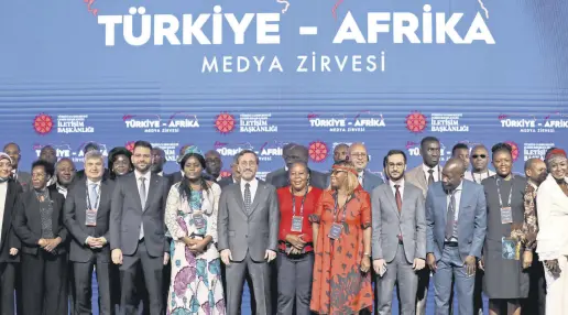  ?? ?? Communicat­ions Director Fahrettin Altun poses for a photo with media representa­tives during the Turkey-Africa Media Summit in Istanbul, Turkey, May 25, 2022.