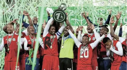  ?? MUZI NTOMBELA/BACKPAGEPI­X ?? Tshakhuma FC celebrates lifting the trophy during the Nedbank Cup Final match against Chippa United at the Free State Stadium in Bloemfonte­in.
