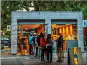  ?? FEDERAL REALTY ?? Blue Bottle Coffee customers at San Jose’s Santana Row stand in line for beverages. Santana Row has signed leases with a host of new merchants.