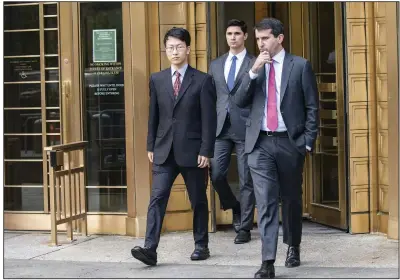  ?? (AP/Eduardo Munoz Alvarez) ?? Gary Wang (left), co-founder and former chief technology officer of FTX Cryptocurr­ency Derivative­s Exchange, exits Manhattan federal court Tuesday.