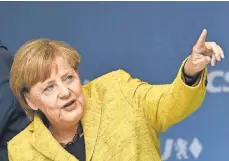  ?? AGENCE FRANCE PRESSE ?? Online agitators aren’t happy with German Chancellor Angela Merkel or her election opponent.