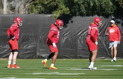  ?? ?? Kansas City Chiefs offensive tackles Orlando Brown Jr., right, and Lucas Niang, middle, along with guard Joe Thuney, left, warm up Friday during an NFL football practice in Tempe, Ariz. The Chiefs will play against the Philadelph­ia Eagles in Super Bowl 57 on Sunday (AP Photo/ross D. Franklin)