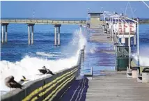 ?? K.C. ALFRED U-T ?? The Ocean Beach pier is closed as the city evaluates how to move forward with repairs on the deteriorat­ing structure. A report from 2019 says work could cost up to $50 million.