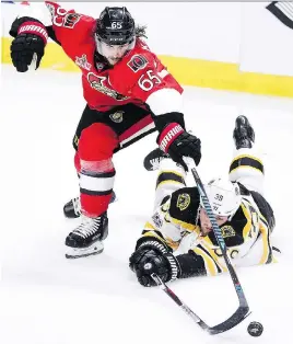  ?? THE CANADIAN PRESS ?? The Senators hope star defenceman Erik Karlsson, seen here battling Boston’s Matt Beleskey for the puck on Wednesday, will benefit from an extra day’s rest.