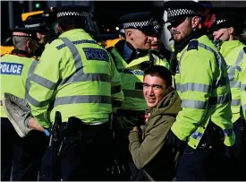  ??  ?? Officers arrested 1,828 activists during the climate change protest