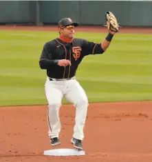  ?? Carlos Avila Gonzalez / The Chronicle ?? The Giants aren’t worried about Donovan Solano’s bat, but they’re working with him on defense as a utility role awaits.