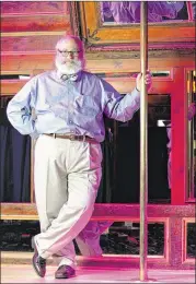  ?? HYOSUB SHIN / HSHIN@AJC.COM 2013 ?? Attorney Alan Begner, who represents most strip clubs in Atlanta, holds a pole on stage at Oasis Goodtime Emporium in Atlanta.