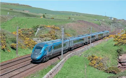  ?? ROBIN STEWARTSMITH ?? TransPenni­ne Express ‘Nova 1’ No. 802209 heads south at Lamberton towards Berwick-upon-Tweed on June 4, with the 10.21 EdinburghN­ewcastle.