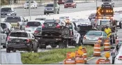  ??  ?? Road Rangers assist stranded drivers on northbound I-95 at 10th Avenue North in Lake Worth on Monday. The spill made the early-morning commute a slog for many drivers from Lantana to West Palm Beach.