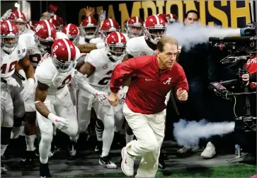  ?? AP PHOTO BY DAVID GOLDMAM ?? Alabama head coach Nick Saban leads his team on the field before the NCAA college football playoff championsh­ip game against Georgia Monday, Jan. 8, in Atlanta.