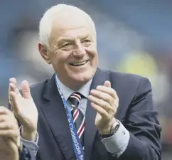  ??  ?? 0 Manager Walter Smith applauds his team’s triumph.