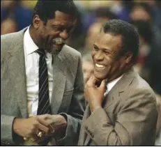  ?? MIKE KULLEN/AP ?? Former Boston Celtics teammates Bill Russell, Sacramento Kings coach (left), and K.C. Jones, Celtics coach, meet before the start of the Kings-Celtics NBA basketball game at the Boston Garden in Boston on Jan. 15, 1988.