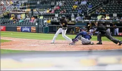  ?? DOUGLAS P. DEFELICE/TNS 2021 ?? Gregory Polanco of the Pittsburgh Pirates prepares to swing at a pitch during a March 2021 at-bat against the Minnesota Twins at LECOM Park in Bradenton, Fla. The Pirates’ relationsh­ip with the park dates to 1969.