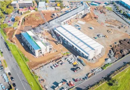  ??  ?? The 5ha industrial site at East Tamaki (left) is getting dressed up for a Green Star rating; The new head office (below) has brought 300 of Waste Management’s staff together and improved their wellbeing.