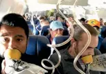  ??  ?? Passengers on the stricken flight have been criticised for not wearing their oxygen masks correctly during the emergency descent and landing.